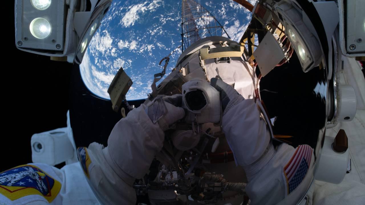 NASA astronaut Michael Hopkins points his cameratoward his spacesuit helmet's reflective shield and takes an out-of-this-world "space-selfie" during a spacewalk he conducted with fellow NASA astronaut Victor Glover. NASA Feb 1, 2021