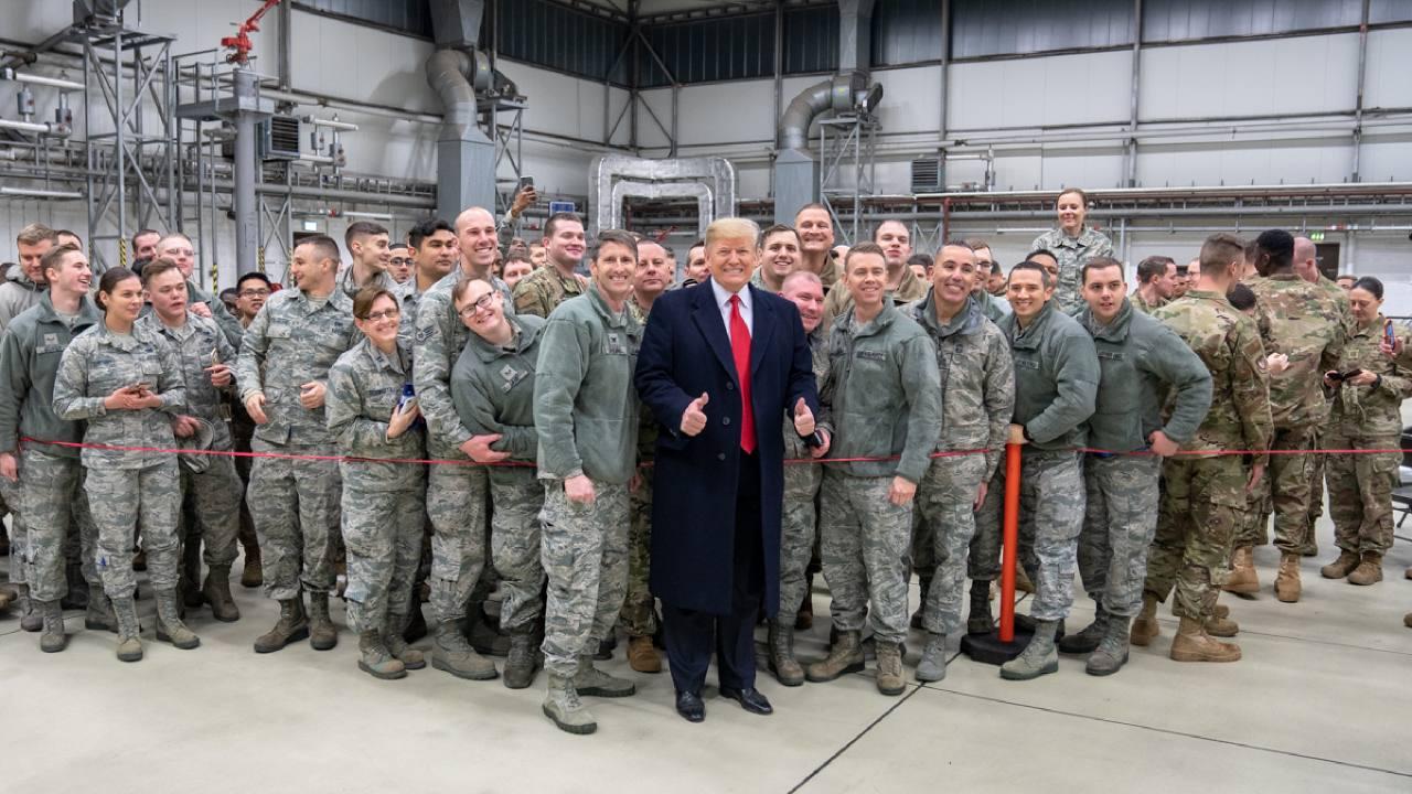 President Donald J. Trump shakes hands and takes photos with military personnel during a stop-over at Ramstein Air Force Base in Germany Wednesday evening, December 26, 2018, following his unannounced visit to U.S. troops at the Al-Asad Airbase in Iraq.