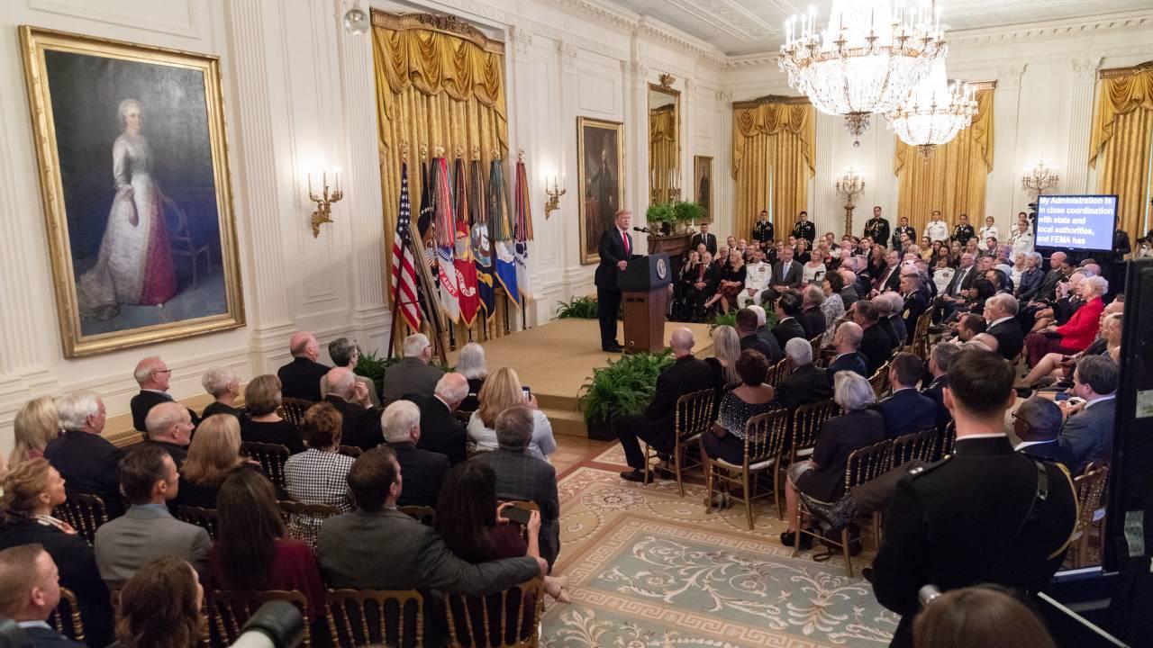 President Donald J. Trump welcomes guests to the Congressional Medal of Honor Society reception Wednesday, Sept. 12, 2018, in the East Room of the White House. (Official White House Photo by Shealah Craighead)
