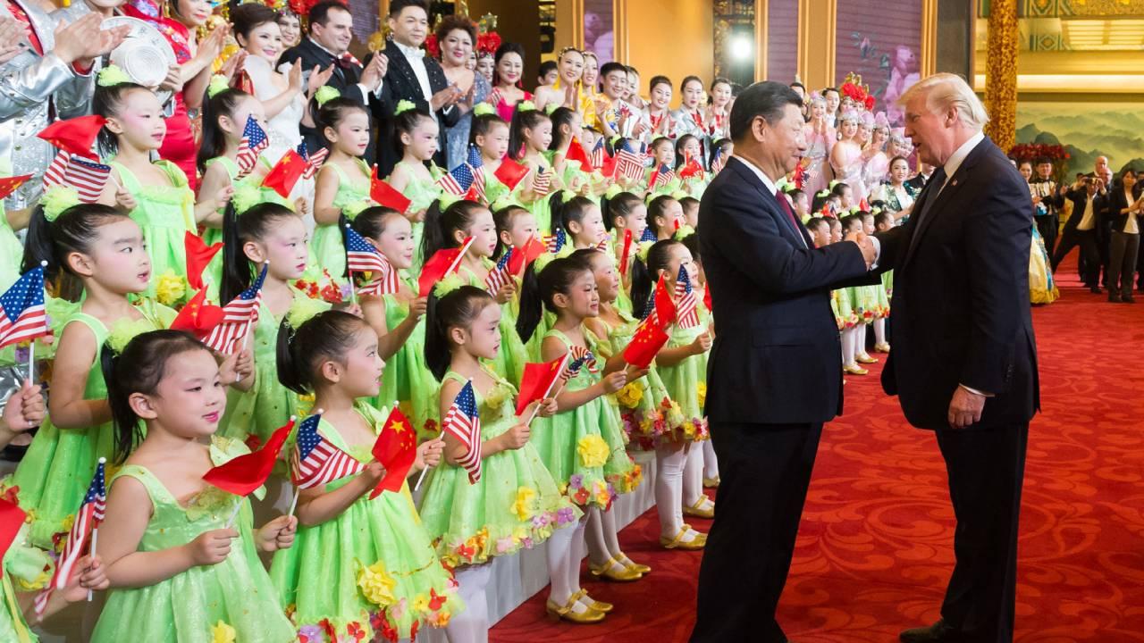Presidents Donald Trump and Xi Jinping shake hands to applaud and thank the performers at a cultural performance at the Great Hall of the People, Thursday, November 9, 2017, in Beijing, China. (Official White House Photo by Andrea Hanks)