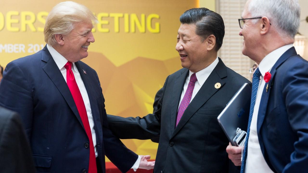 Presidents Donald Trump and Xi Jingping exchange greetings at the APEC Summit | November 11, 2017 (Official Whitehouse Photo)