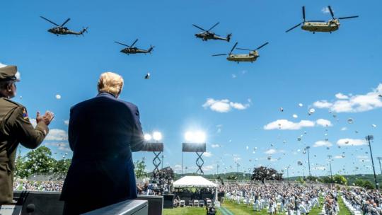 President Trump, joined by LTG Darryl Williams, 60th Superintendent of the United States Military Academy at West Point, observes a helicopter flyover at the conclusion of the United States Military Academy commencement ceremony Saturday, June 13, 2020.